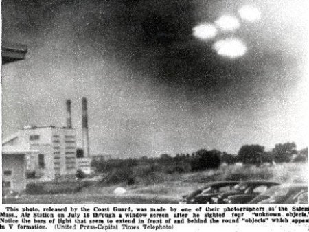 This photo, released by the Coast Guard, was made by one of their photographers at the Salem, Mass. Air    Station on July 16 through a window screen after he sighted four "unknown objects." Notice the bars of light that    seem to extend in front of and behind the round "objects" which appear in V formation. s1United Press-Capital Times    Telephoto
