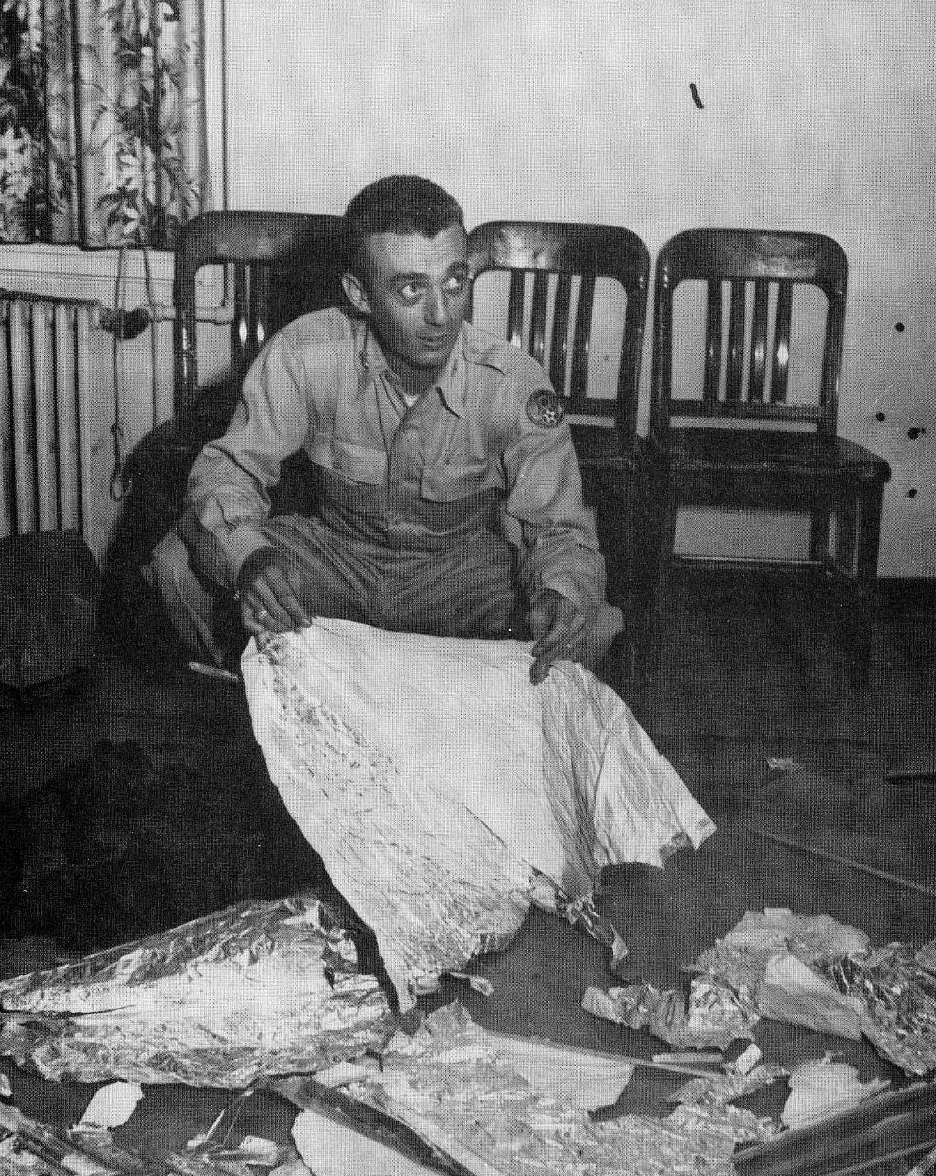 Fig. 10 - Major Jesse Marcel, Sr., the Chief Intelligence Officer at    the Roswell Army Air Force Base in 1947. Marcel claims that he was ordered to pose with bogus baloon debris so that    the incident would become a laughingstock s13USAF
